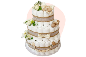 Gâteau de couches fleuri et jouets bois pour baby shower chez fleuriste-montauban à Montauban
